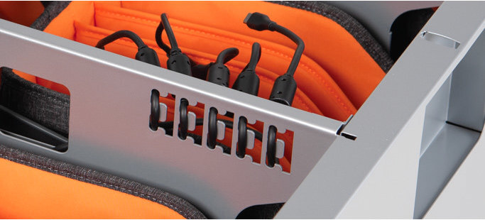 a few cables organized in the notched hooks of a Bretford CUBE Toploader Cart with Caddies